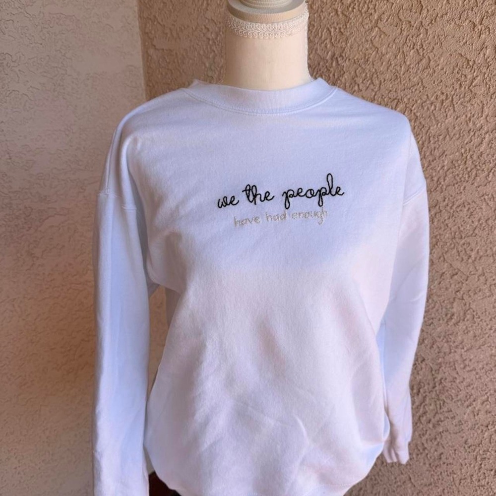 "We the people are tired" white long sleeve sweatshirt